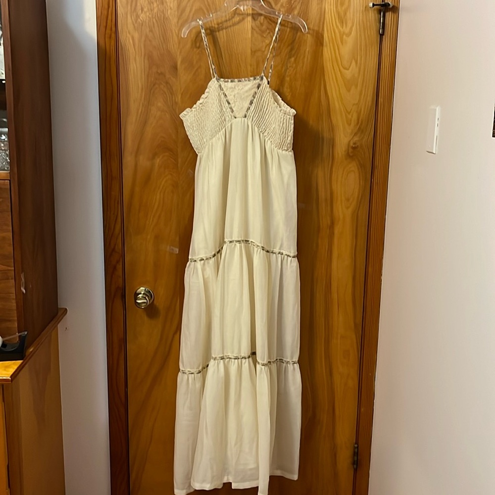 A woman’s long, cotton/polyester dress
